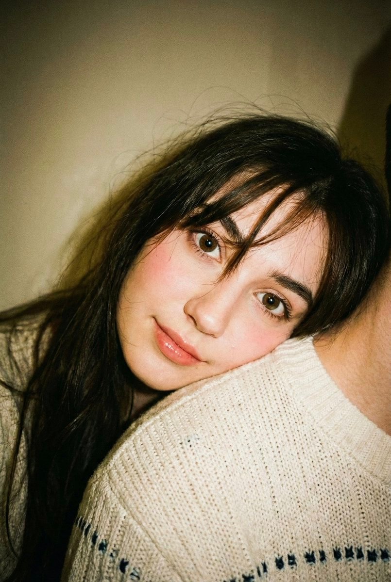 Edit this photo without changing the face. Portrait aspect ratio 2:3. Disposable camera aesthetic with a candid, warm, a AI photo prompt example