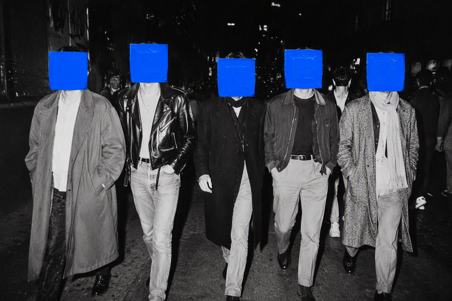 A black and white analog night street photograph set in a large city, with a group of young people wearing 1980s-style c AI photo prompt example